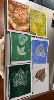 Yellow, blue, brown, red, green, and dark green leaf imprints